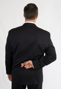 Businessman with fingers crossed behind back Businessman with fingers crossed behind back