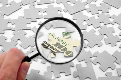 US dollar puzzle and magnifier Finding the money